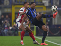 Denzel Dumfries of FC Internazionale competes for the ball with Jurrien Timber of Arsenal during the UEFA Champions League 2024/25 League Ph...