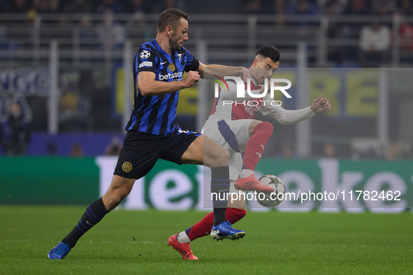 Gabriel Martinelli of Arsenal competes for the ball with Stefan de Vrij during the UEFA Champions League 2024/25 League Phase MD4 match betw...