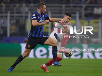 Gabriel Martinelli of Arsenal competes for the ball with Stefan de Vrij during the UEFA Champions League 2024/25 League Phase MD4 match betw...