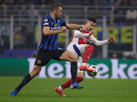 Gabriel Martinelli of Arsenal competes for the ball with Stefan de Vrij during the UEFA Champions League 2024/25 League Phase MD4 match betw...