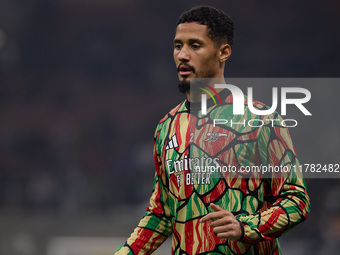 William Saliba of Arsenal warms up before the UEFA Champions League 2024/25 League Phase MD4 match between FC Internazionale Milano and Arse...