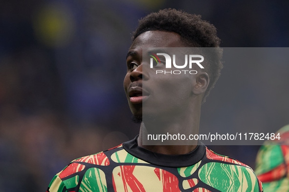 Bukayo Saka of Arsenal warms up before the UEFA Champions League 2024/25 League Phase MD4 match between FC Internazionale Milano and Arsenal...