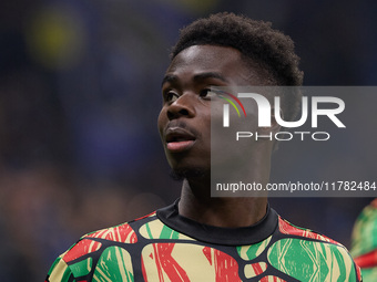 Bukayo Saka of Arsenal warms up before the UEFA Champions League 2024/25 League Phase MD4 match between FC Internazionale Milano and Arsenal...