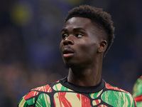 Bukayo Saka of Arsenal warms up before the UEFA Champions League 2024/25 League Phase MD4 match between FC Internazionale Milano and Arsenal...