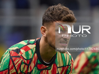 Ben White of Arsenal warms up before the UEFA Champions League 2024/25 League Phase MD4 match between FC Internazionale Milano and Arsenal F...