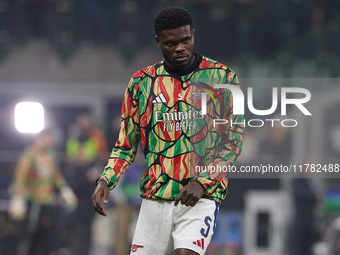 Thomas Partey of Arsenal warms up before the UEFA Champions League 2024/25 League Phase MD4 match between FC Internazionale Milano and Arsen...