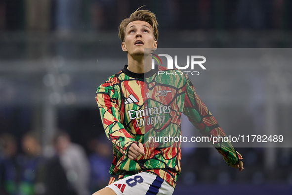 Martin Odegaard of Arsenal warms up before the UEFA Champions League 2024/25 League Phase MD4 match between FC Internazionale Milano and Ars...