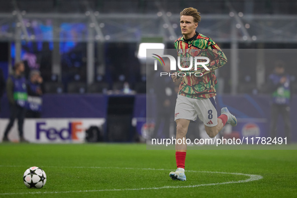 Martin Odegaard of Arsenal warms up before the UEFA Champions League 2024/25 League Phase MD4 match between FC Internazionale Milano and Ars...