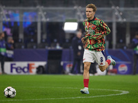 Martin Odegaard of Arsenal warms up before the UEFA Champions League 2024/25 League Phase MD4 match between FC Internazionale Milano and Ars...