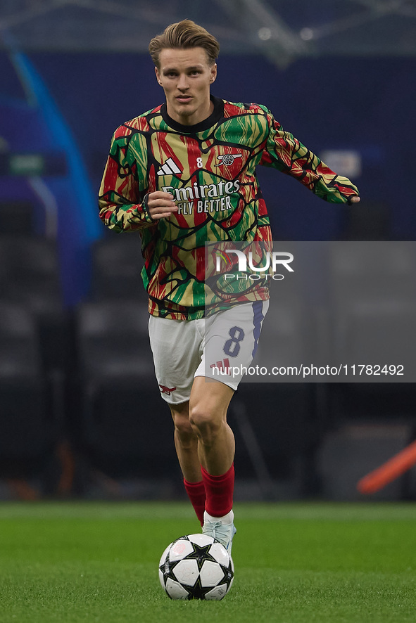 Martin Odegaard of Arsenal warms up before the UEFA Champions League 2024/25 League Phase MD4 match between FC Internazionale Milano and Ars...