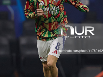 Martin Odegaard of Arsenal warms up before the UEFA Champions League 2024/25 League Phase MD4 match between FC Internazionale Milano and Ars...