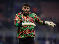 David Raya of Arsenal warms up before the UEFA Champions League 2024/25 League Phase MD4 match between FC Internazionale Milano and Arsenal...