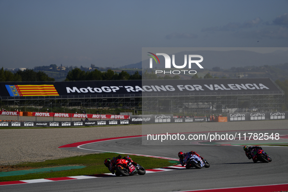 Francesco Pecco Bagnaia (1) of Italy and Ducati Lenovo Team Marc Marquez (93) of Spain and Gresini Racing Moto GP Ducati and Franco Morbidel...