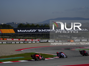 Francesco Pecco Bagnaia (1) of Italy and Ducati Lenovo Team Marc Marquez (93) of Spain and Gresini Racing Moto GP Ducati and Franco Morbidel...