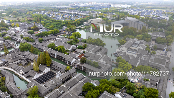 Tourists play at a scenic spot in Wuzhen, Zhejiang province, China, on November 16, 2024. 