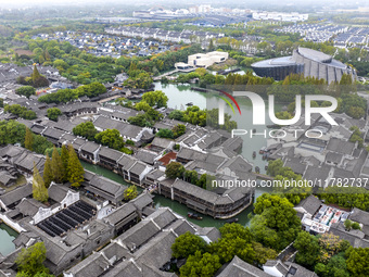 Tourists play at a scenic spot in Wuzhen, Zhejiang province, China, on November 16, 2024. (