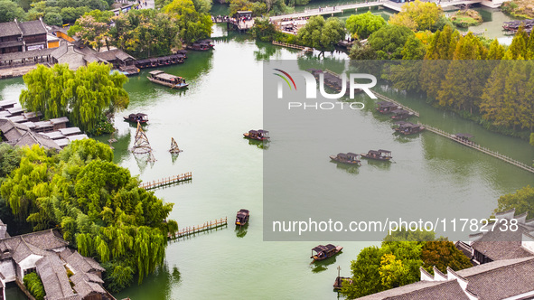 Tourists play at a scenic spot in Wuzhen, Zhejiang province, China, on November 16, 2024. 