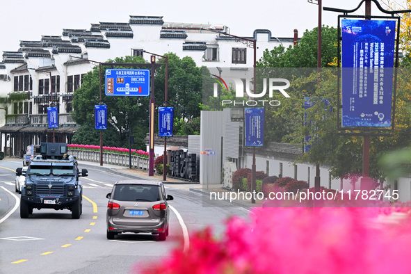 Flags of the World Internet Conference 2024 are seen on a street in Wuzhen, Zhejiang province, China, on November 16, 2024. 