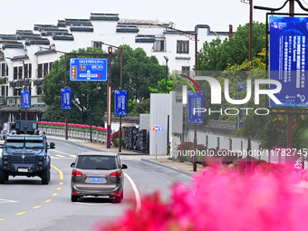 Flags of the World Internet Conference 2024 are seen on a street in Wuzhen, Zhejiang province, China, on November 16, 2024. (