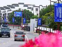 Flags of the World Internet Conference 2024 are seen on a street in Wuzhen, Zhejiang province, China, on November 16, 2024. (