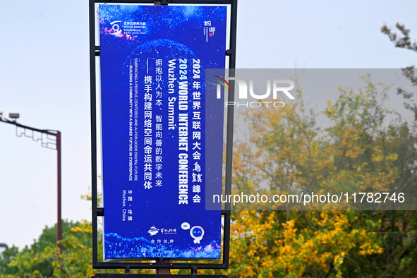 Flags of the World Internet Conference 2024 are seen on a street in Wuzhen, Zhejiang province, China, on November 16, 2024. 