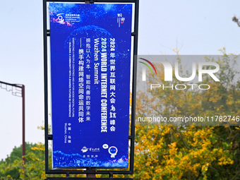 Flags of the World Internet Conference 2024 are seen on a street in Wuzhen, Zhejiang province, China, on November 16, 2024. (