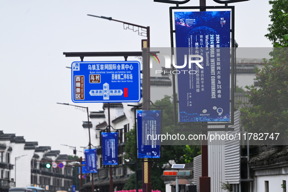 Flags of the World Internet Conference 2024 are seen on a street in Wuzhen, Zhejiang province, China, on November 16, 2024. 