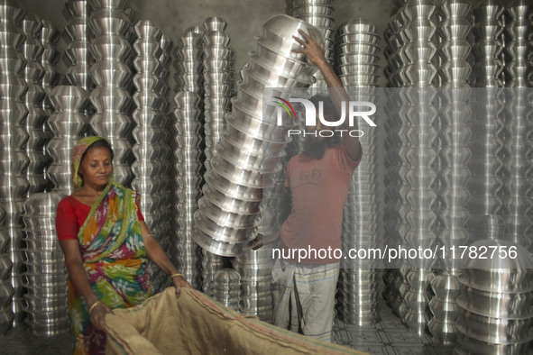 A laborer works inside an aluminum factory in Kamrangirchar, Dhaka, Bangladesh, on November 16, 2024. 