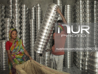 A laborer works inside an aluminum factory in Kamrangirchar, Dhaka, Bangladesh, on November 16, 2024. (