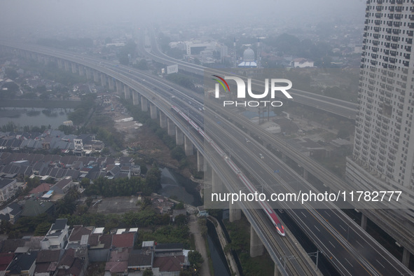 The Jakarta-Bandung high-speed train, also known as Whoosh, is seen crossing Bekasi, West Java, on Saturday, November 16, 2024. Deputy Minis...