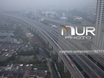 The Jakarta-Bandung high-speed train, also known as Whoosh, is seen crossing Bekasi, West Java, on Saturday, November 16, 2024. Deputy Minis...