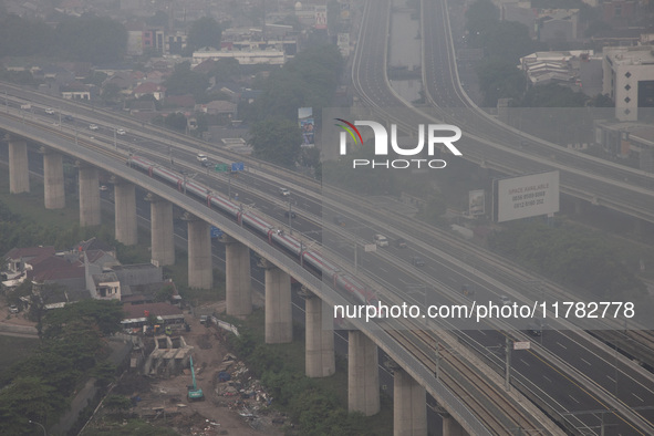 The Jakarta-Bandung high-speed train, also known as Whoosh, is seen crossing Bekasi, West Java, on Saturday, November 16, 2024. Deputy Minis...