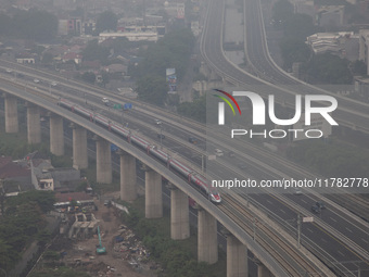 The Jakarta-Bandung high-speed train, also known as Whoosh, is seen crossing Bekasi, West Java, on Saturday, November 16, 2024. Deputy Minis...