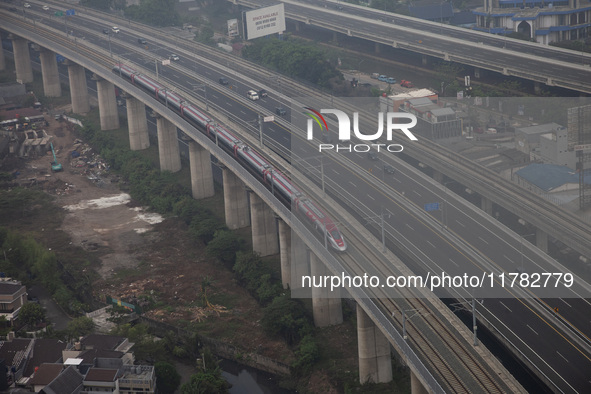 The Jakarta-Bandung high-speed train, also known as Whoosh, is seen crossing Bekasi, West Java, on Saturday, November 16, 2024. Deputy Minis...