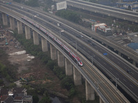 The Jakarta-Bandung high-speed train, also known as Whoosh, is seen crossing Bekasi, West Java, on Saturday, November 16, 2024. Deputy Minis...