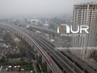 The Jakarta-Bandung high-speed train, also known as Whoosh, is seen crossing Bekasi, West Java, on Saturday, November 16, 2024. Deputy Minis...