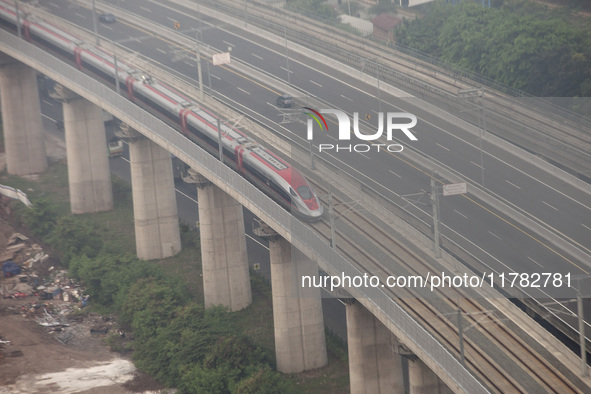 The Jakarta-Bandung high-speed train, also known as Whoosh, is seen crossing Bekasi, West Java, on Saturday, November 16, 2024. Deputy Minis...