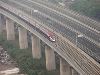 The Jakarta-Bandung high-speed train, also known as Whoosh, is seen crossing Bekasi, West Java, on Saturday, November 16, 2024. Deputy Minis...