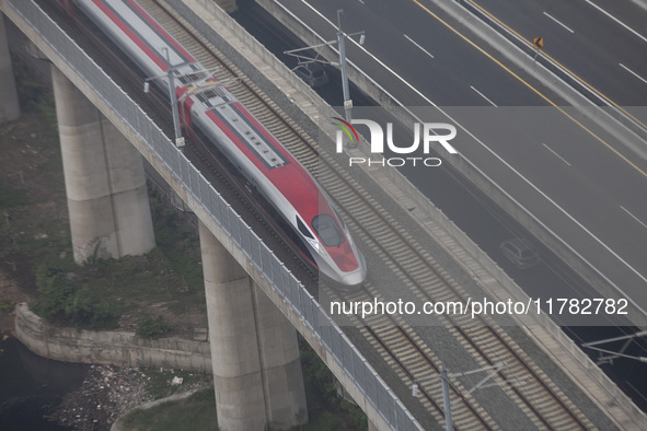 The Jakarta-Bandung high-speed train, also known as Whoosh, is seen crossing Bekasi, West Java, on Saturday, November 16, 2024. Deputy Minis...