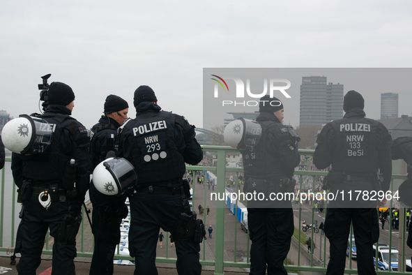 Police are present at the demonstration site as thousands of Kurds demonstrate for the release of Kurdish Leader Abdullah Ocalan in Cologne,...