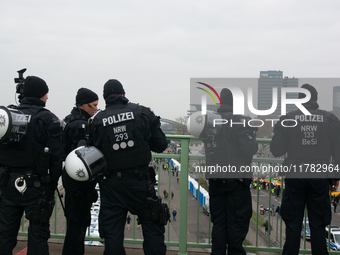 Police are present at the demonstration site as thousands of Kurds demonstrate for the release of Kurdish Leader Abdullah Ocalan in Cologne,...