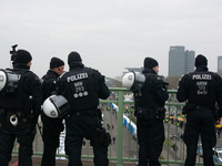 Police are present at the demonstration site as thousands of Kurds demonstrate for the release of Kurdish Leader Abdullah Ocalan in Cologne,...