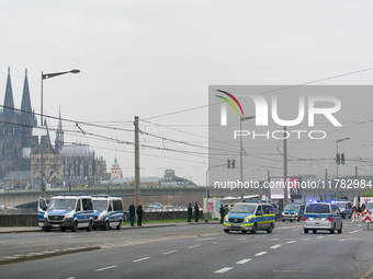 Police are present at the demonstration site as thousands of Kurds demonstrate for the release of Kurdish Leader Abdullah Ocalan in Cologne,...