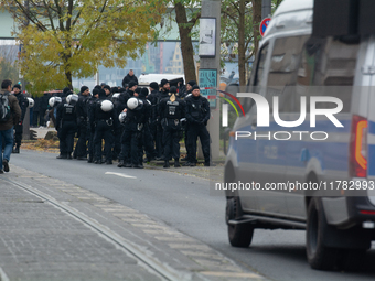 Police are present at the demonstration site as thousands of Kurds demonstrate for the release of Kurdish Leader Abdullah Ocalan in Cologne,...