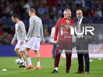 Michal Probierz, Head Coach of Poland, talks with a staff member prior to the UEFA Nations League 2024/25 League A Group A1 match between Po...