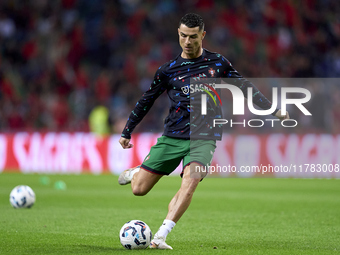 Cristiano Ronaldo of Portugal warms up before the UEFA Nations League 2024/25 League A Group A1 match between Portugal and Poland at Estadio...