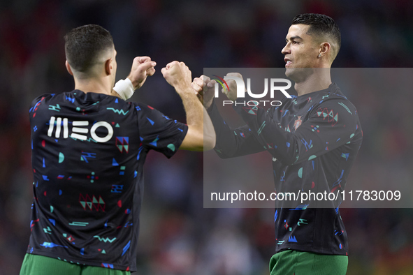 Cristiano Ronaldo of Portugal shakes hands with Diogo Dalot of Portugal before the UEFA Nations League 2024/25 League A Group A1 match betwe...