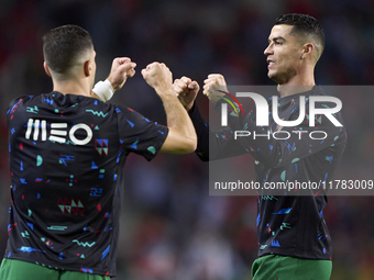 Cristiano Ronaldo of Portugal shakes hands with Diogo Dalot of Portugal before the UEFA Nations League 2024/25 League A Group A1 match betwe...