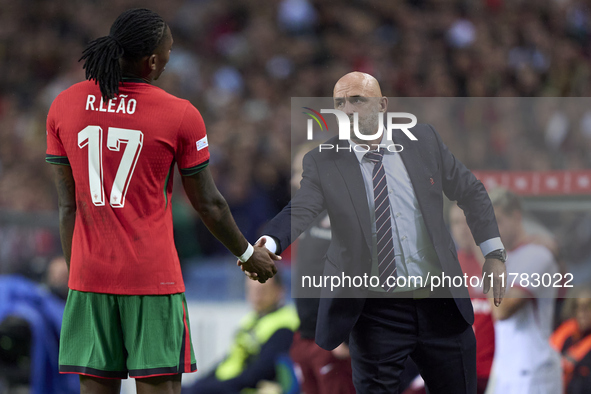 Michal Probierz, Head Coach of Poland, shakes hands with Rafael Leao of Portugal during the UEFA Nations League 2024/25 League A Group A1 ma...