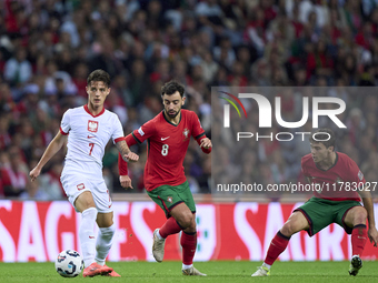 Bruno Fernandes of Portugal competes for the ball with Kacper Urbanski of Poland during the UEFA Nations League 2024/25 League A Group A1 ma...